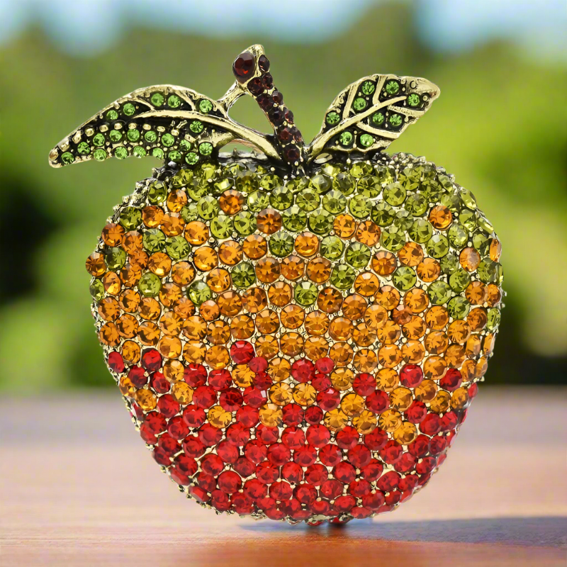 Unique apple lapel pin styled on a casual outfit, showcasing its vibrant colors.