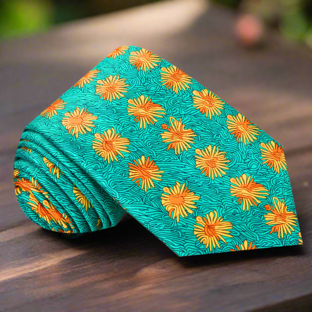Floral Burst Silk Necktie showcasing orange flowers against a green background, perfect for weddings.