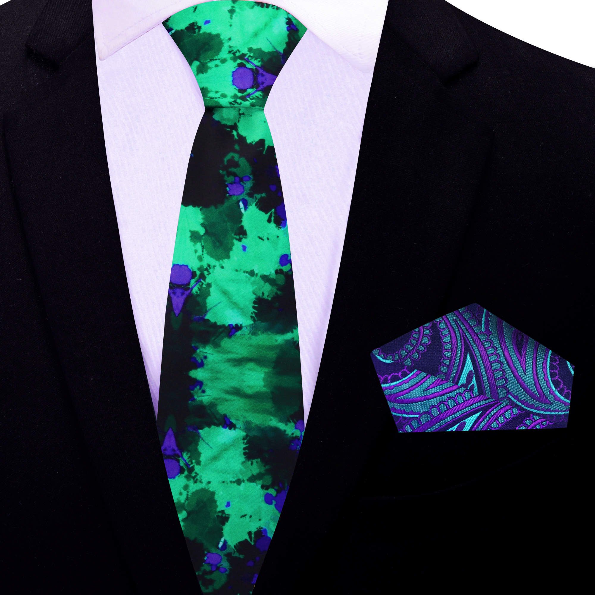 Flat lay of the stylish ink blot necktie with a matching paisley pocket square.