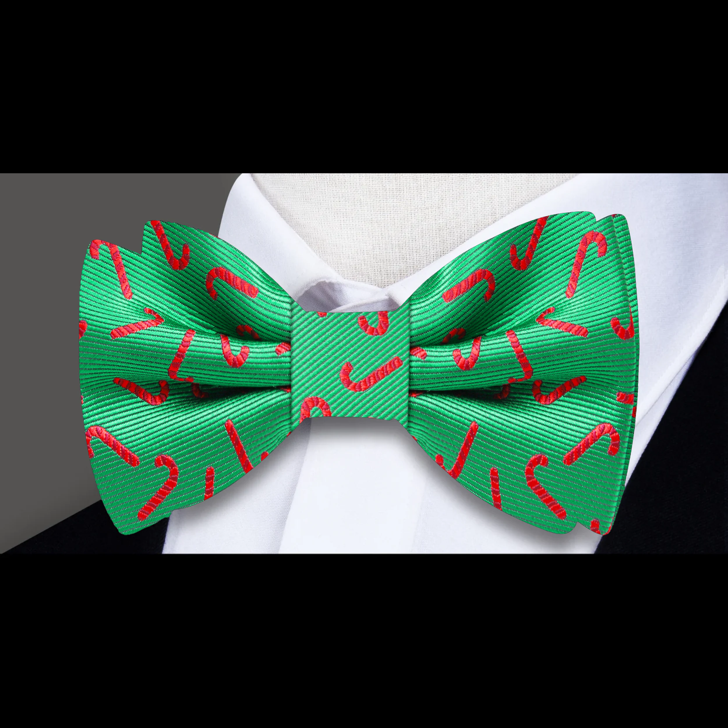 Flat lay of the bow tie and matching pocket square styled for a Christmas dinner outfit