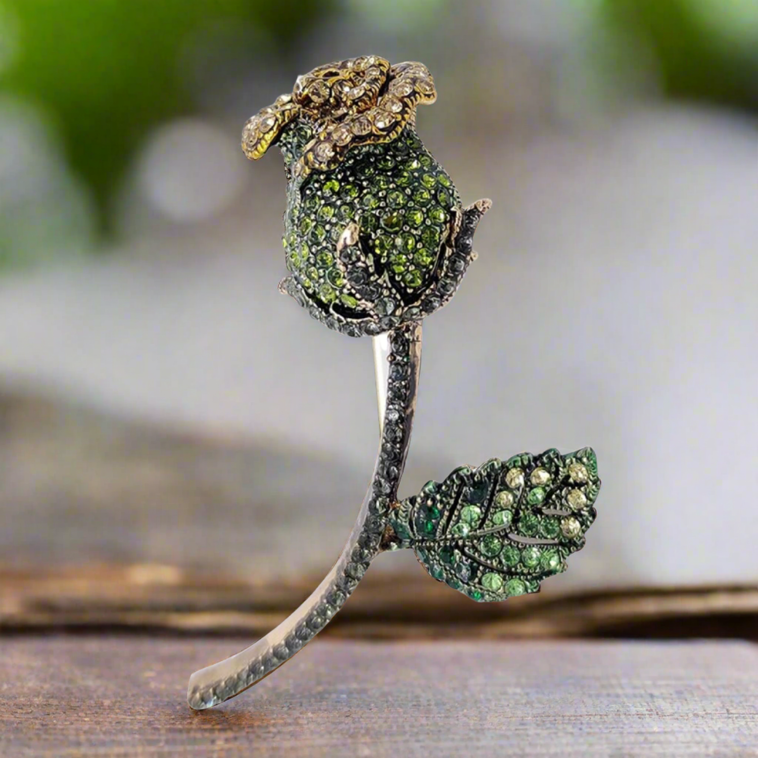 Stylish green gemstone lapel pin against a navy dress shirt, perfect for garden parties.