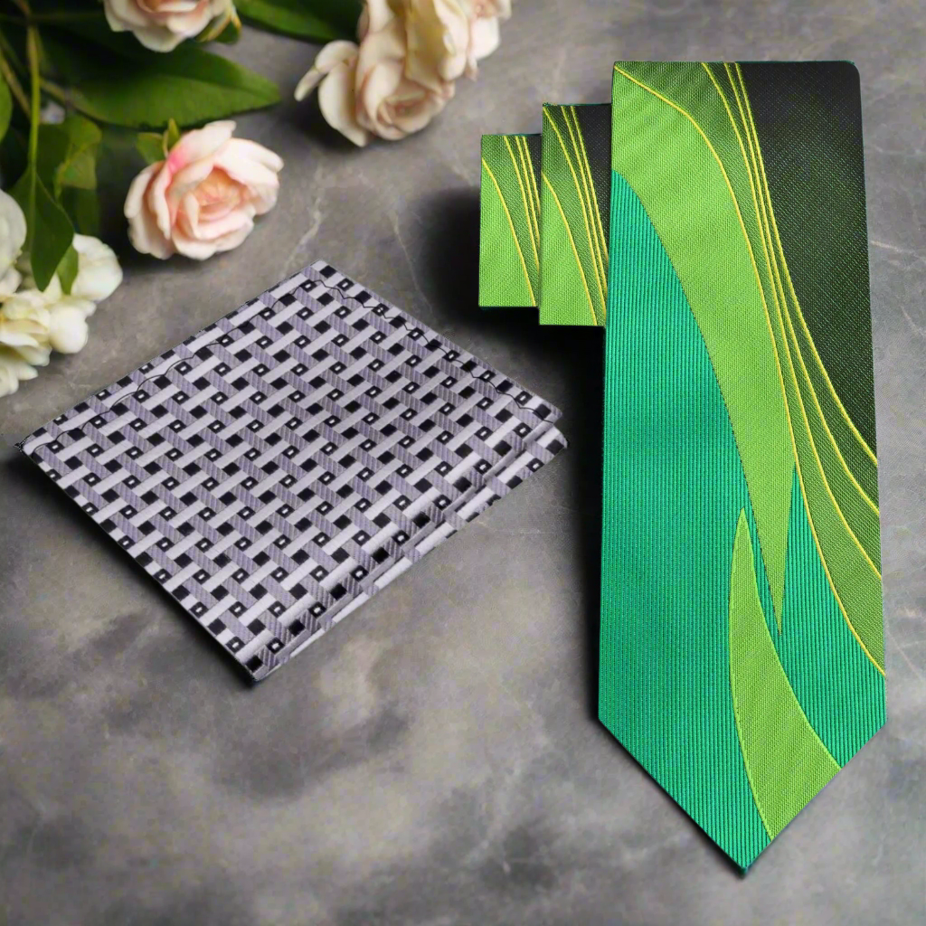 Close-up of the vibrant green and yellow abstract silk tie, highlighting its modern design