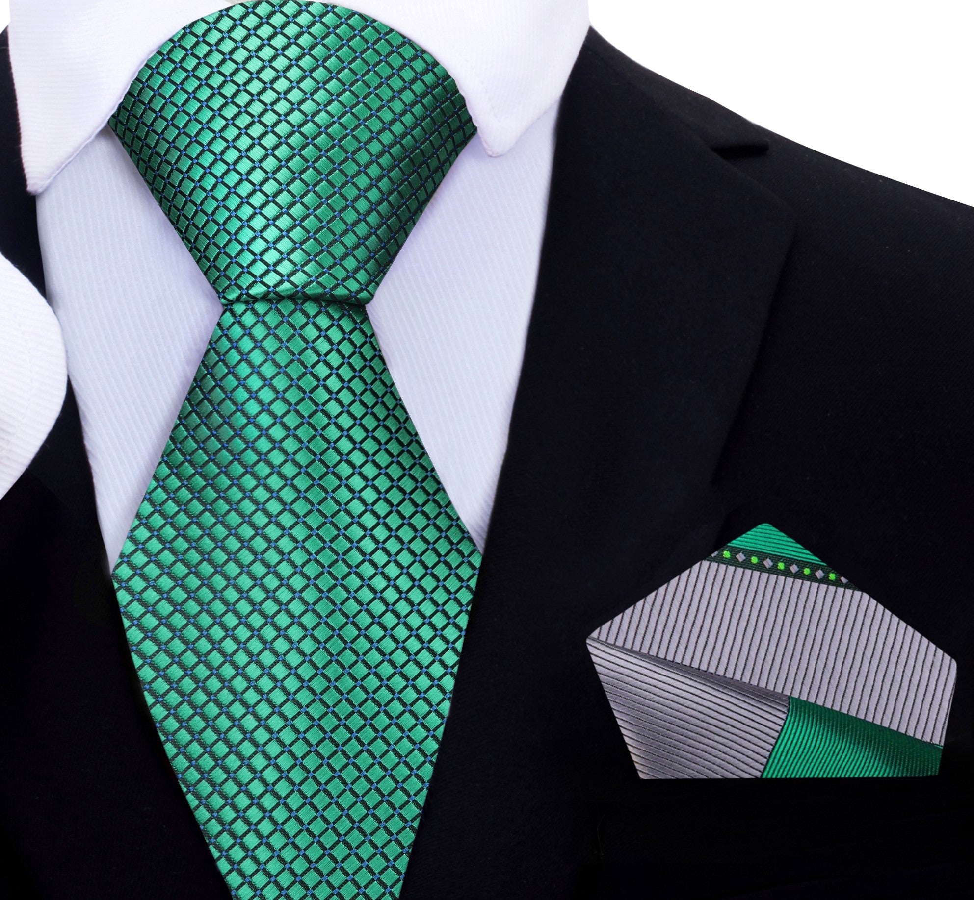 Green geometric silk tie styled with a navy suit, ideal for weddings or business meetings.