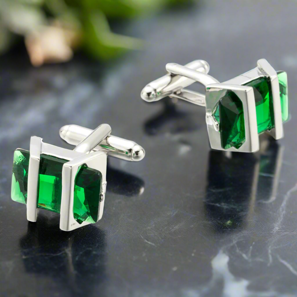 Close-up view of chrome greenstone cufflinks highlighting the intricate design and vibrant stones.