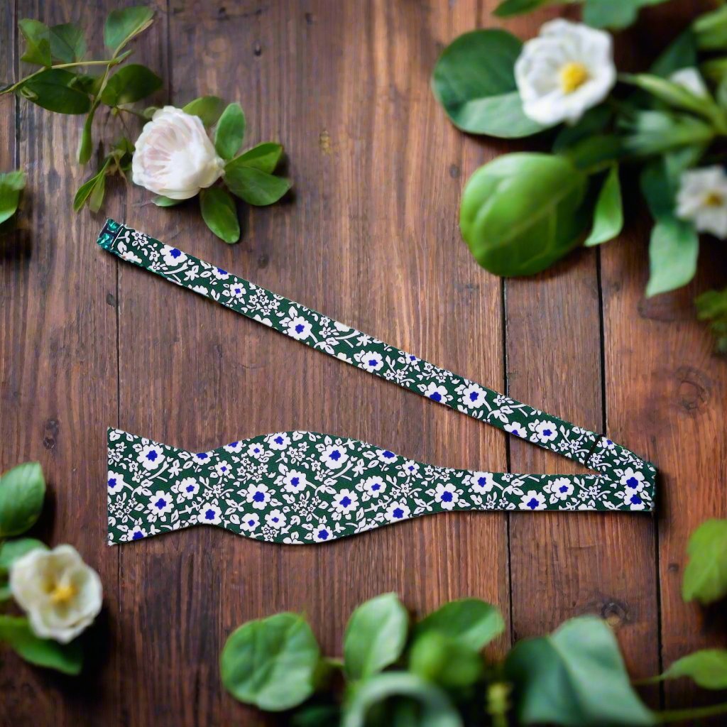 Detail shot of silk bow tie with intricate floral pattern, highlighting craftsmanship and fabric quality