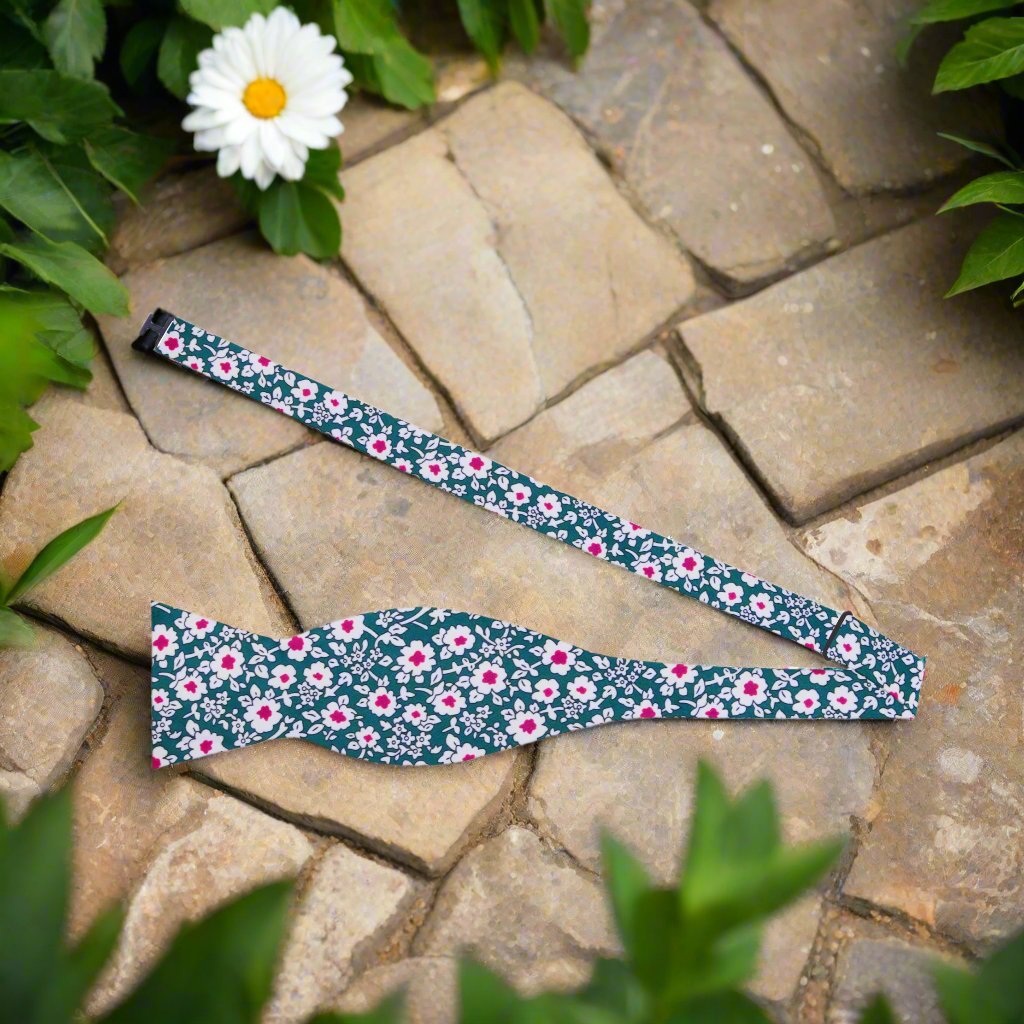 Elegant floral bow tie paired with outdoor wedding attire, suitable for garden parties