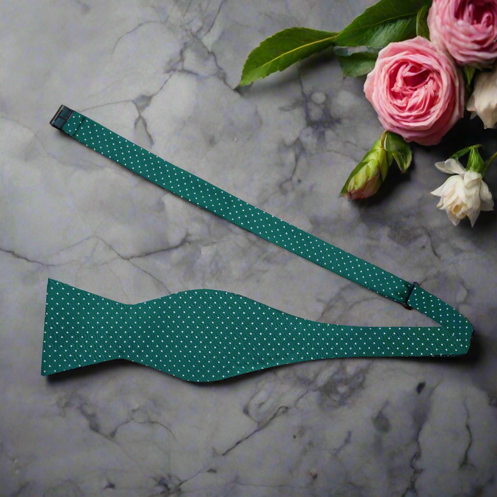 Close-up of burgundy microdot silk bow tie, highlighting its subtle contrast and elegance.