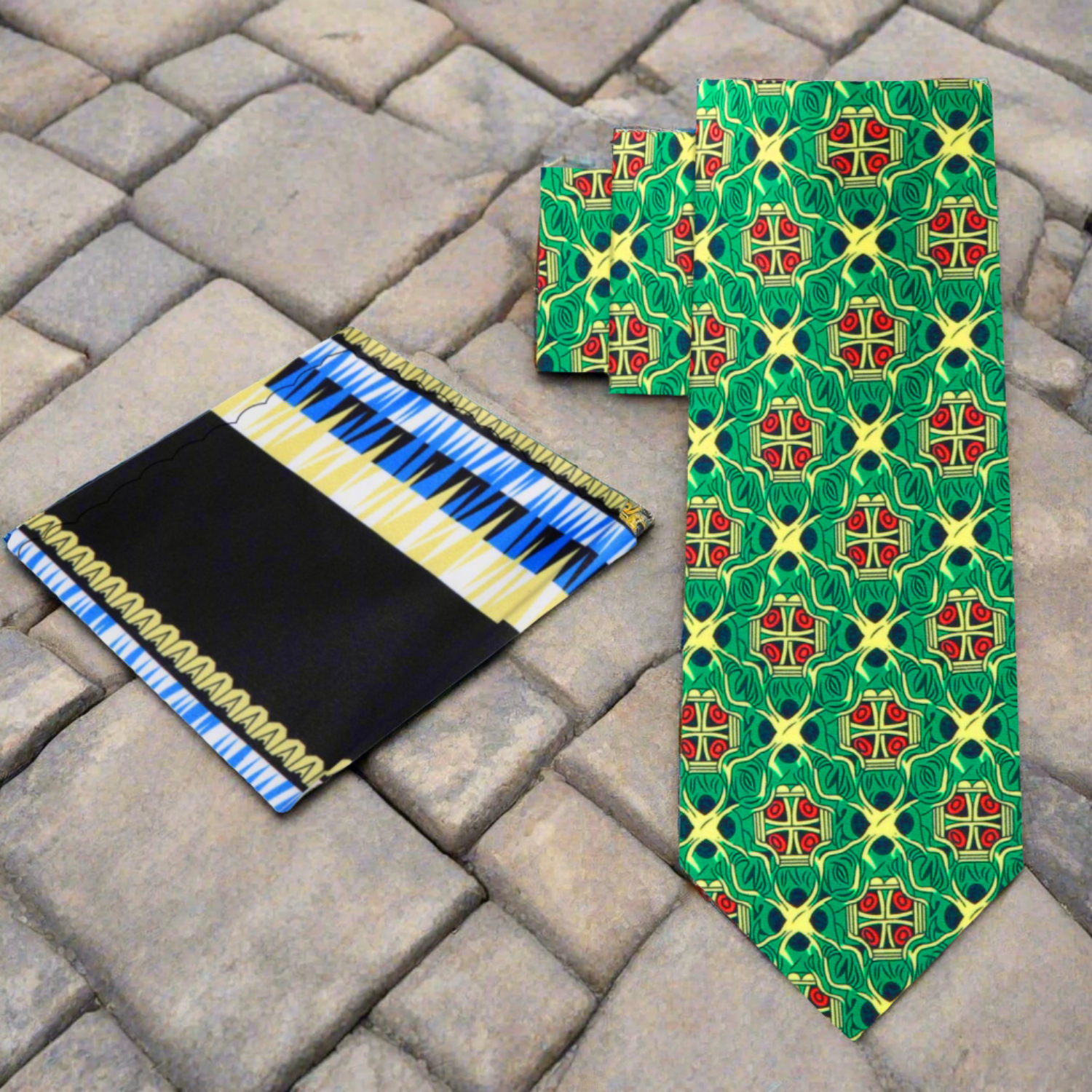 Close-up of the vibrant green silk tie featuring an abstract pattern in yellow, red, and black.