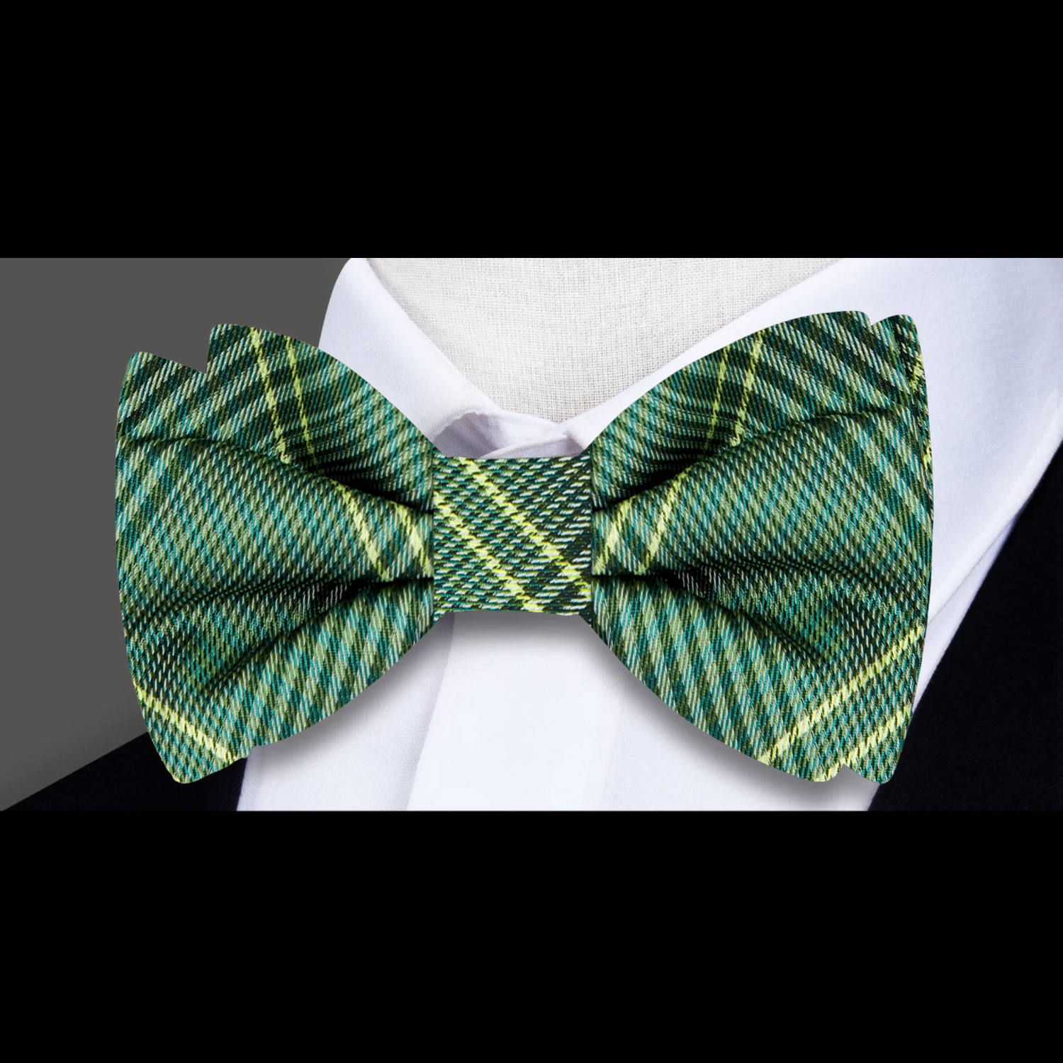 Elegant mens bow tie in green and yellow plaid pattern, suitable for formal occasions