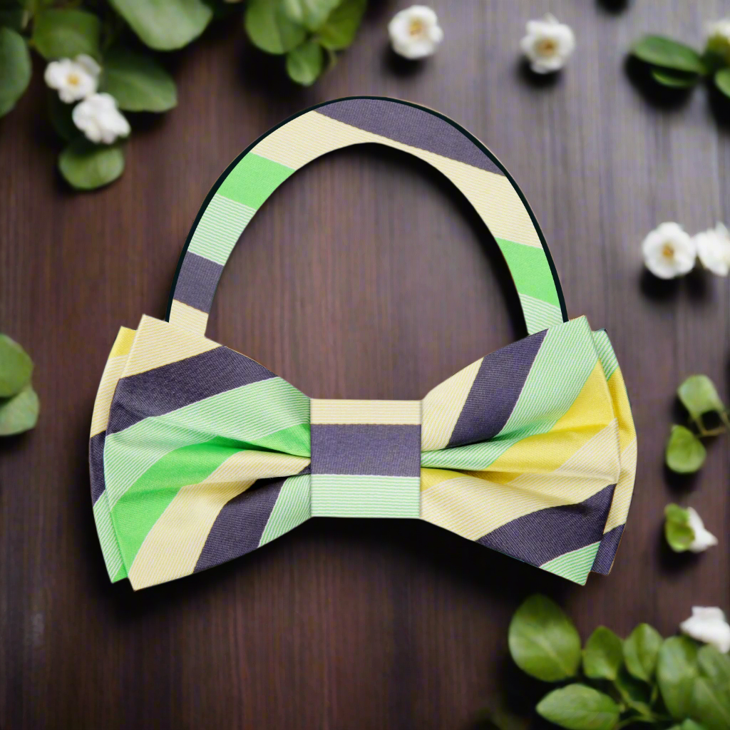 Close-up of charming pastel striped bow tie against a light background.