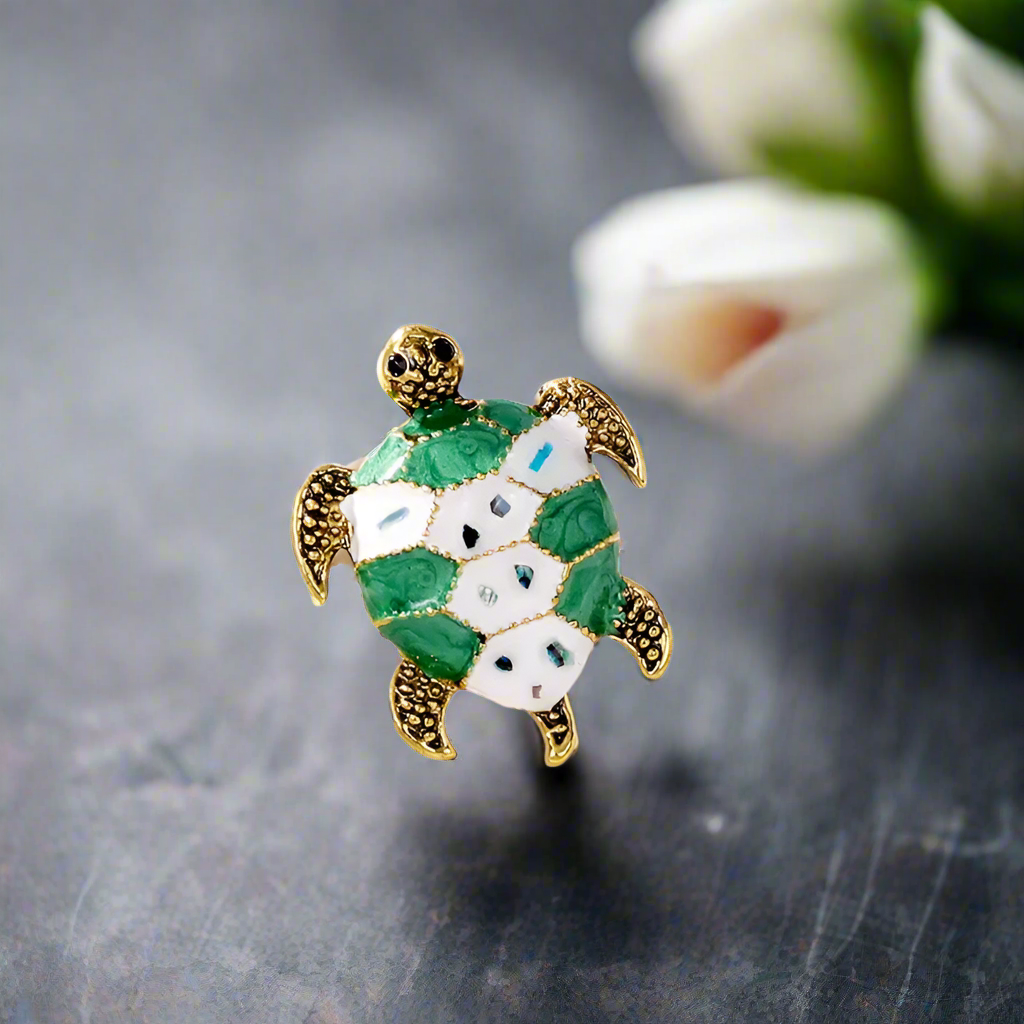 Eco-friendly sea turtle lapel pin on a navy suit lapel