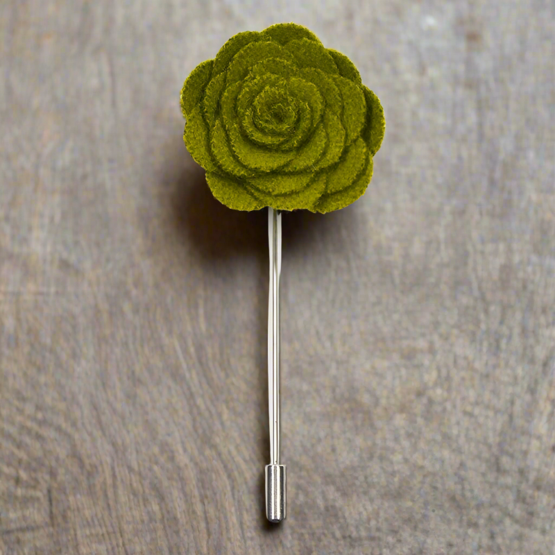 Close-up of vibrant petal lapel pin on a suit jacket