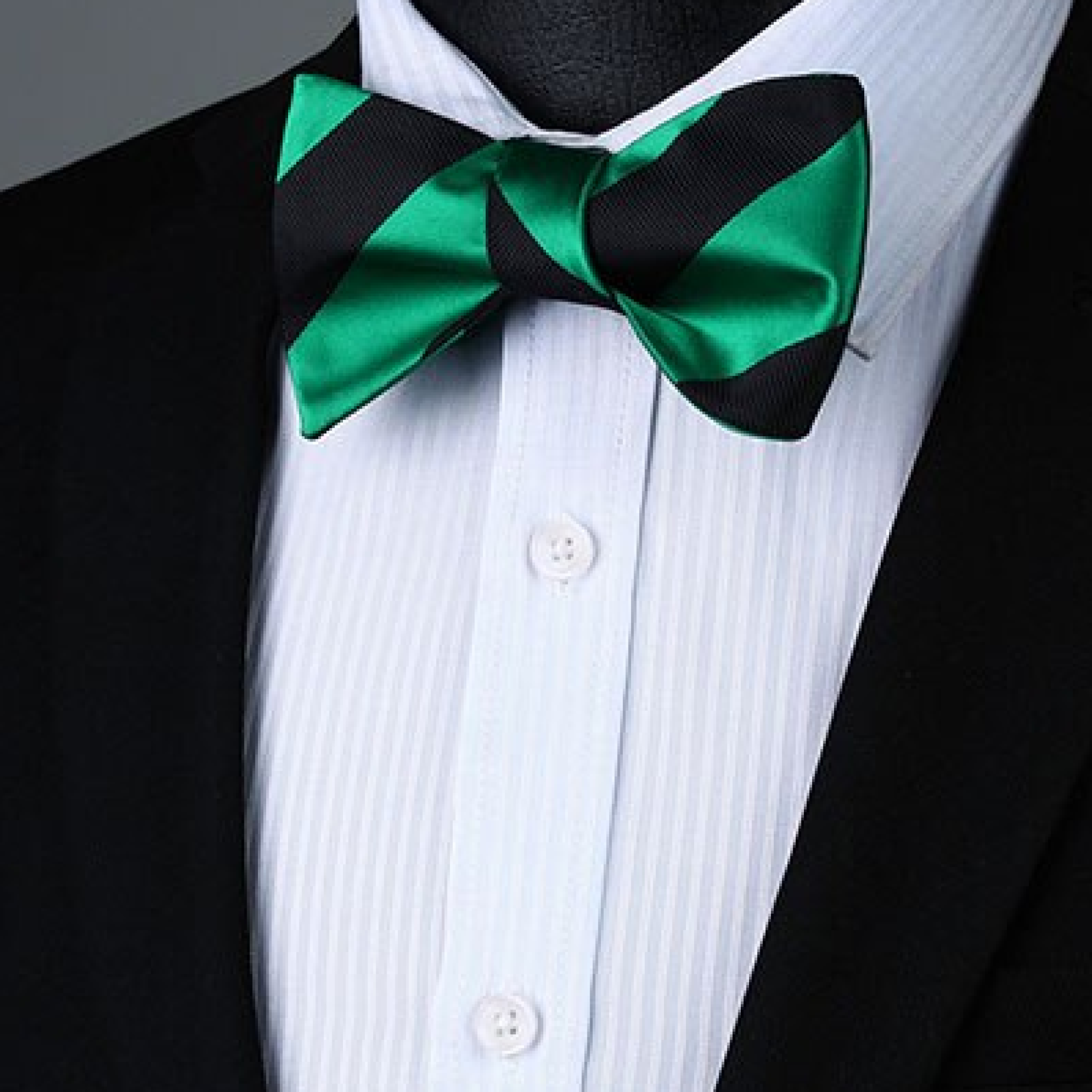 Styled shot of a striped bow tie and matching pocket square for cocktail party outfit