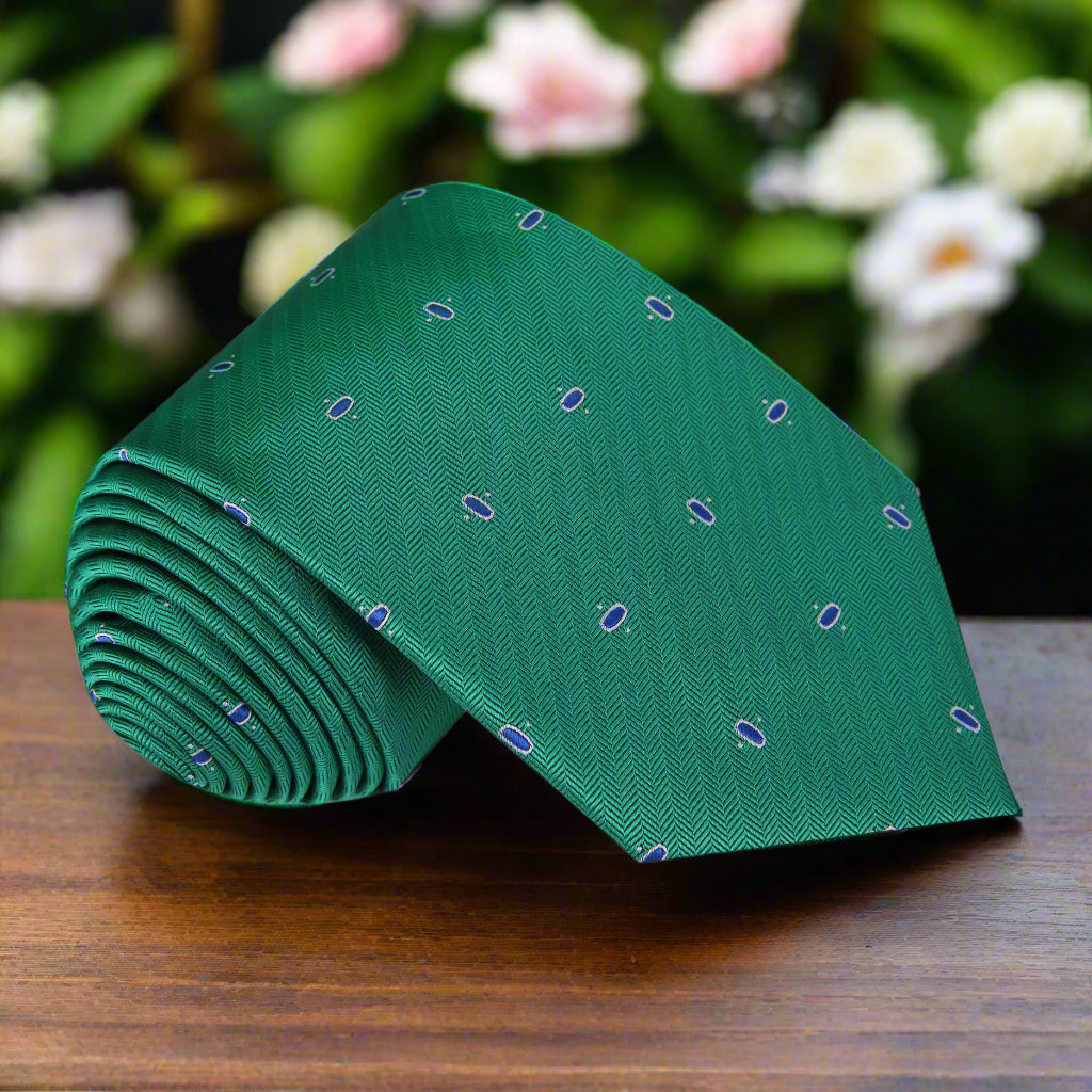 Close-up of Cadence Classic Silk Tie displaying green and blue ovals pattern, ideal for formal occasions.