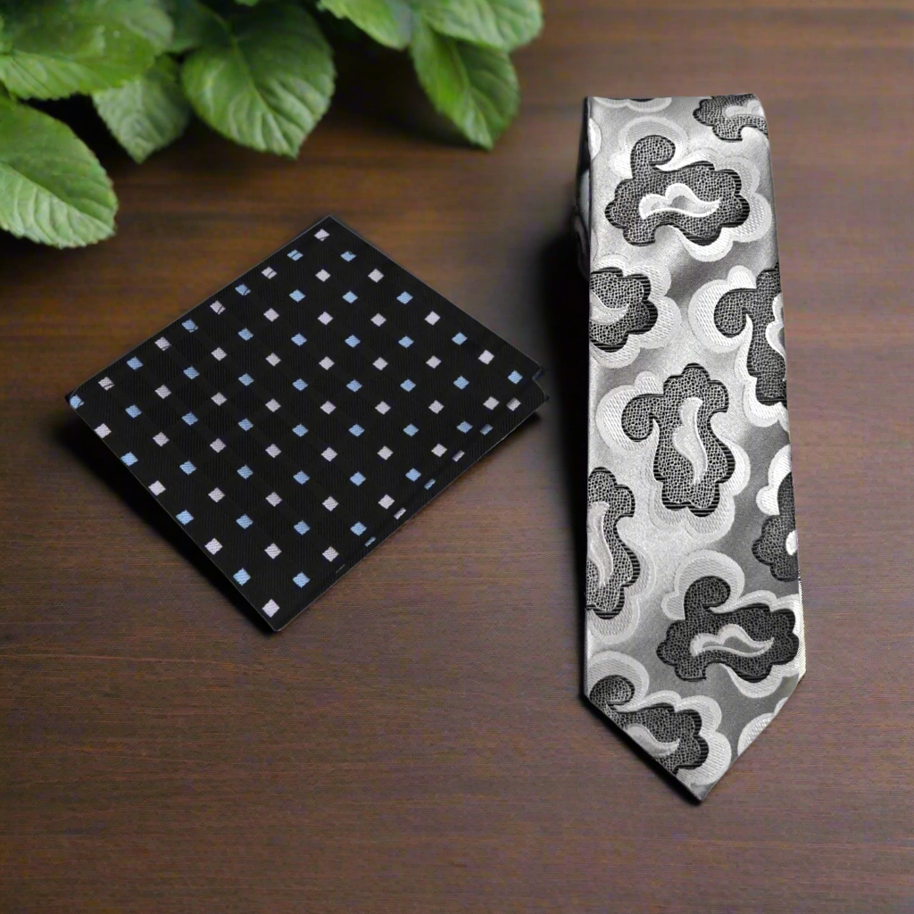 Close-up of the abstract silk necktie with swirling grey and black patterns