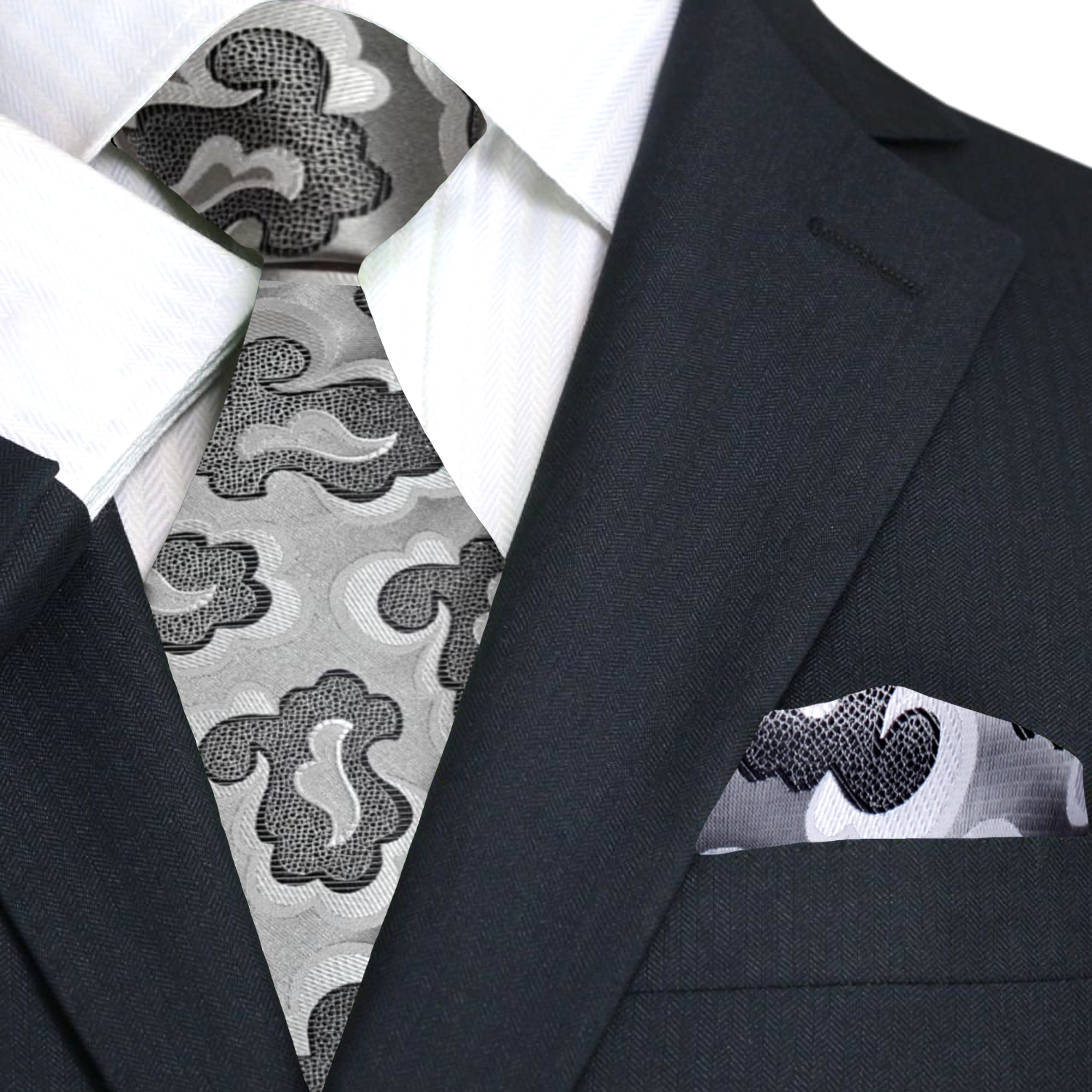 Fashionable mens tie styled with a charcoal suit for evening event