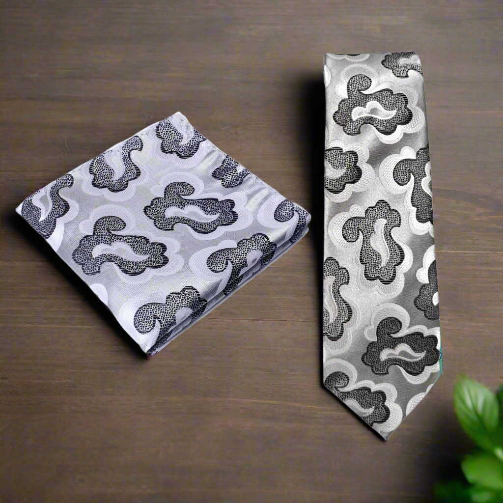 Close-up of the abstract silk necktie with swirling grey and black patterns