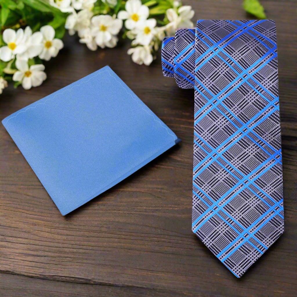 Close-up of silver and blue plaid silk necktie on a hanger, showcasing the pattern and fabric quality