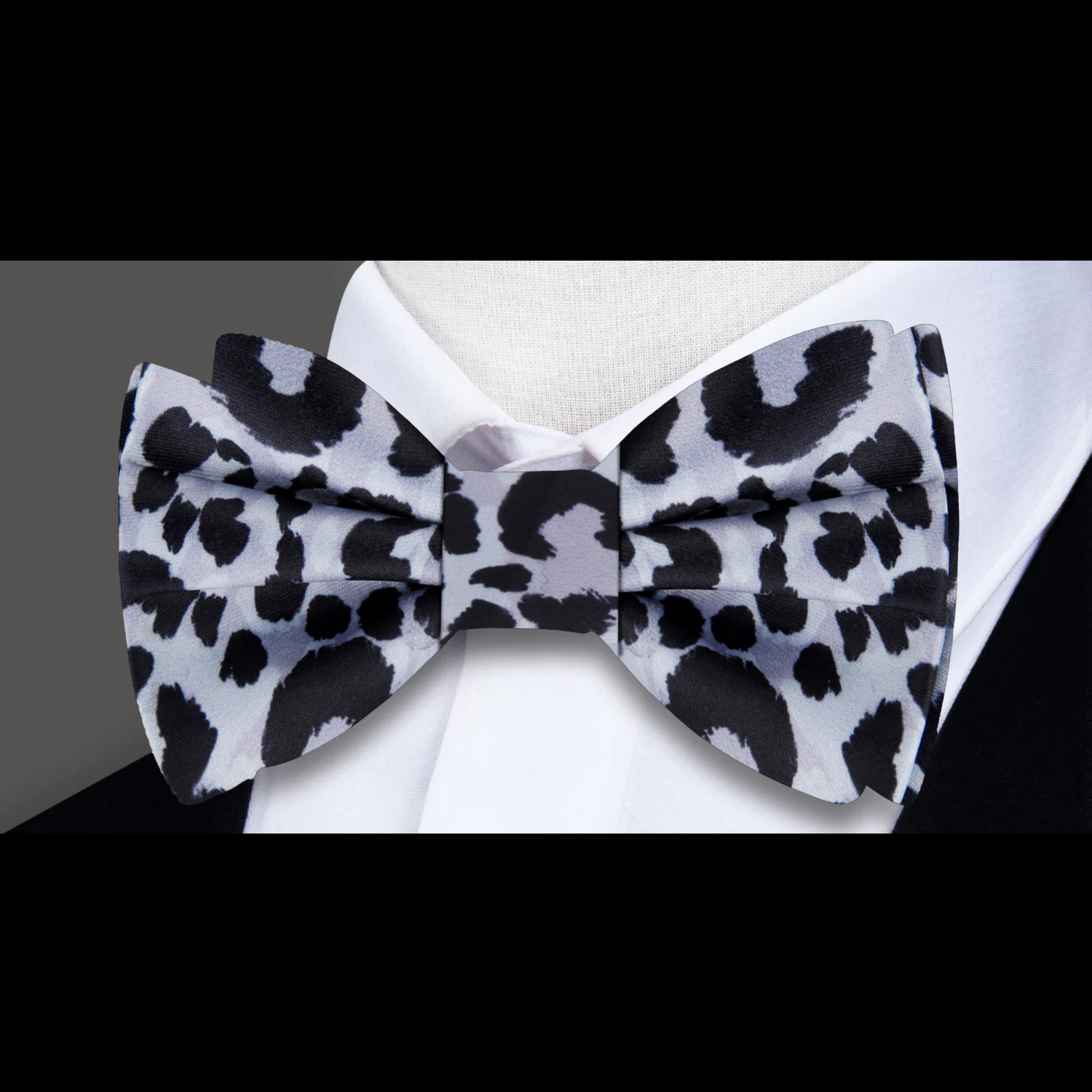 Close-up of a stylish mens bow tie with adjustable strap and wild animal print