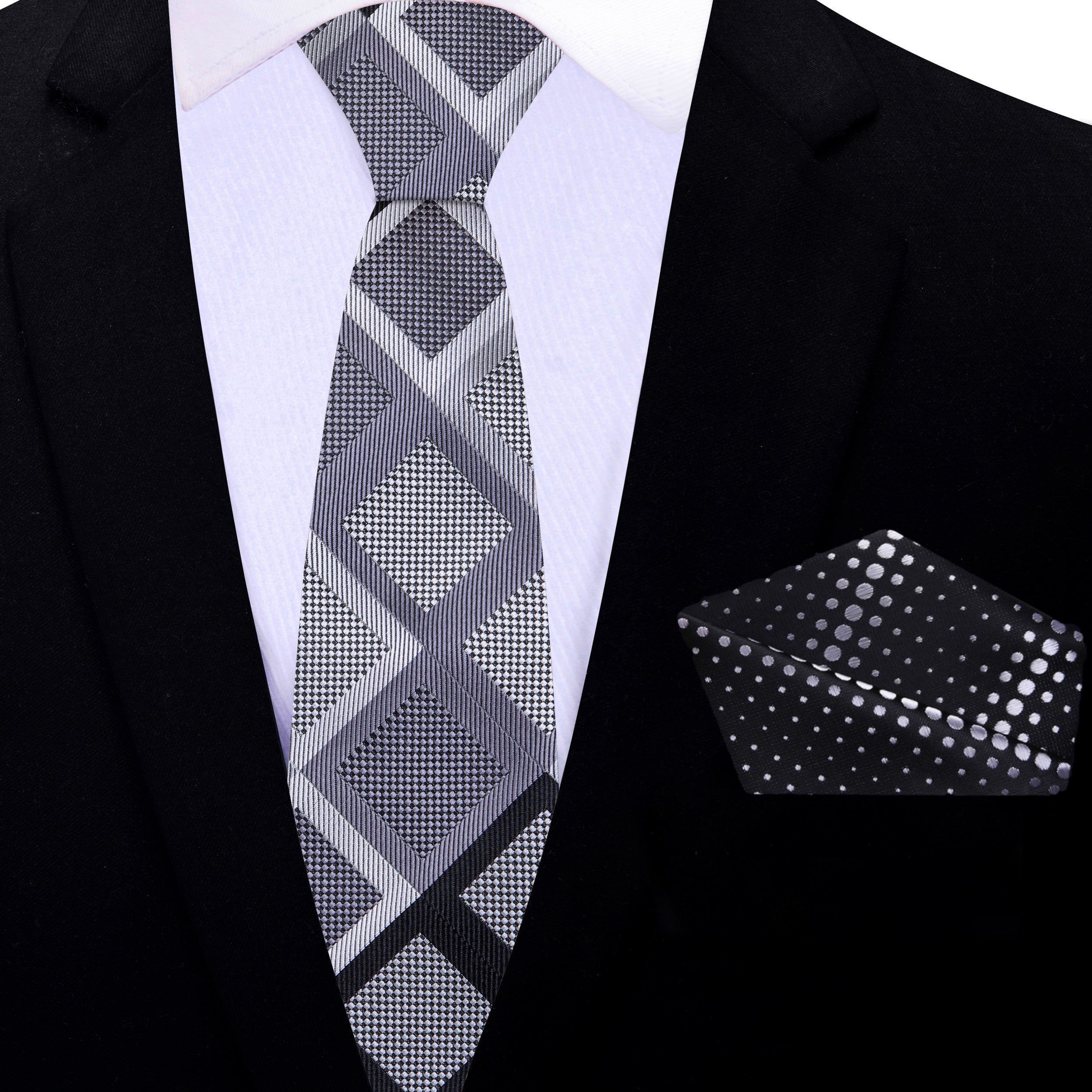 Close-up view of mens silk tie with geometric diamond pattern, ideal for weddings