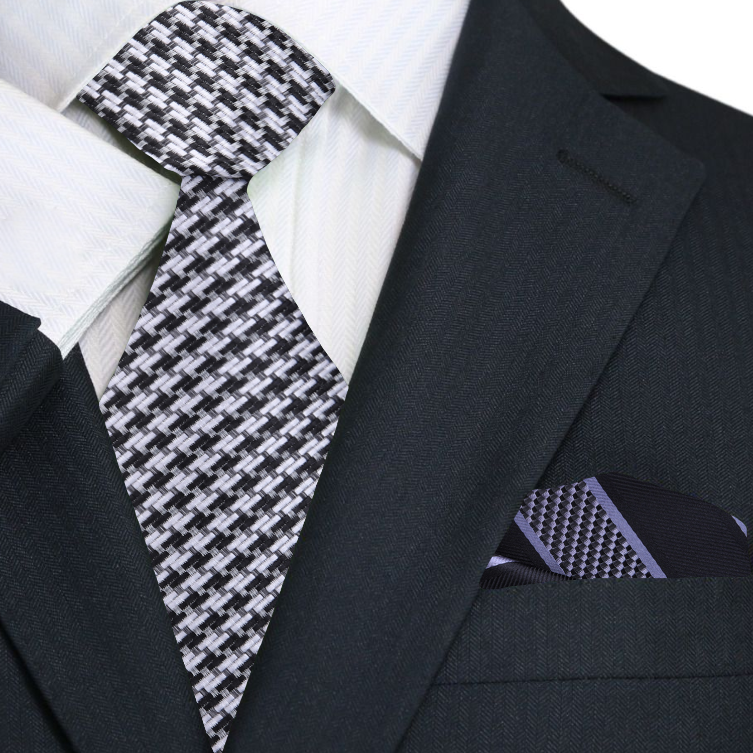 Man wearing a black suit with a grey silk houndstooth tie for a formal event