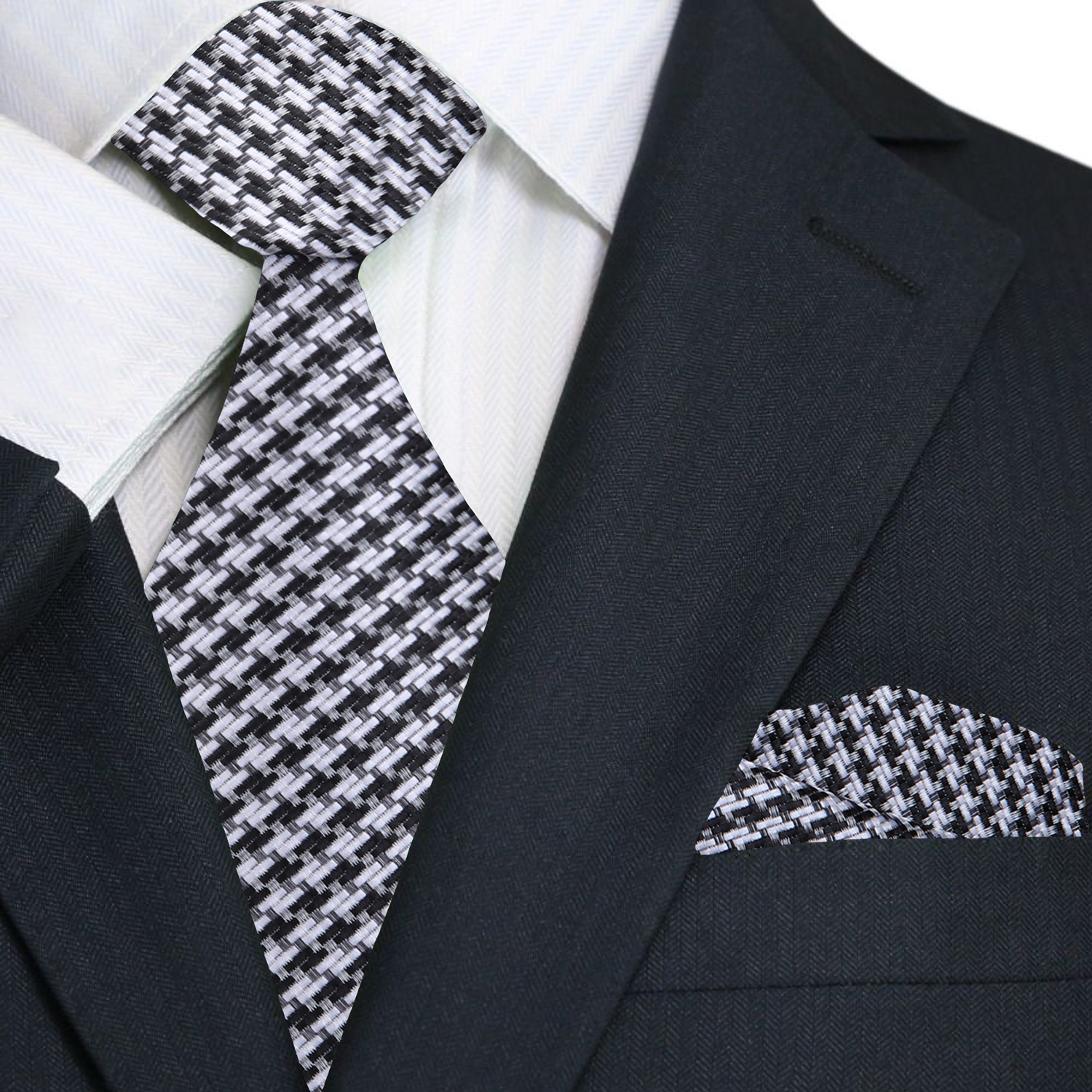 Close-up of grey and black houndstooth silk tie on a mannequin