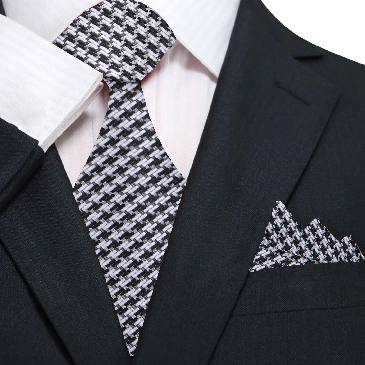 Close-up of metallic gold and black houndstooth silk necktie showcasing intricate pattern