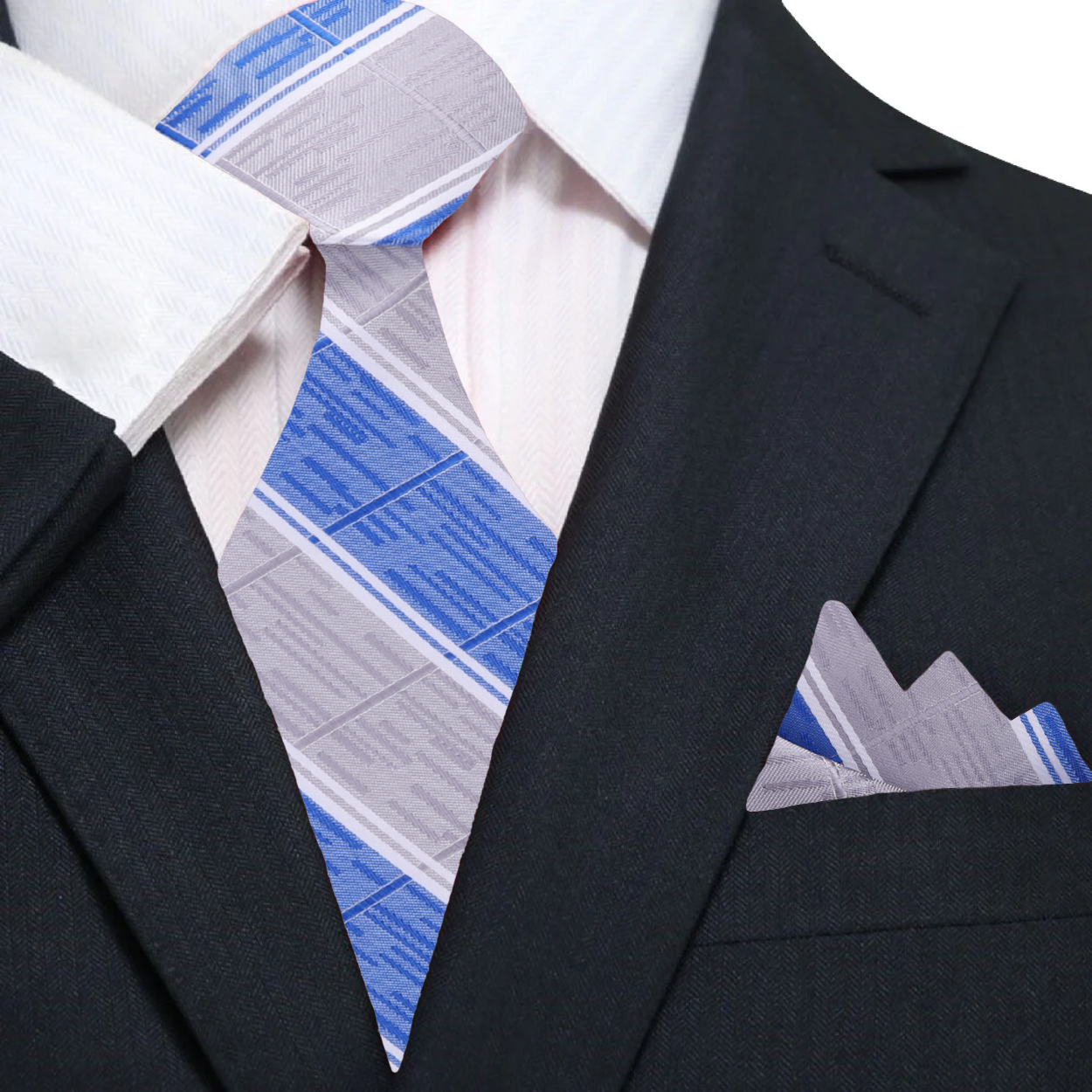 Man wearing a mens silk tie with a striped pattern paired with a white dress shirt
