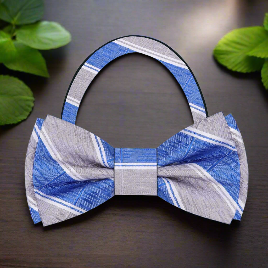 Front view of the blue plaid silk bow tie on a mannequin, highlighting its pattern and craftsmanship.