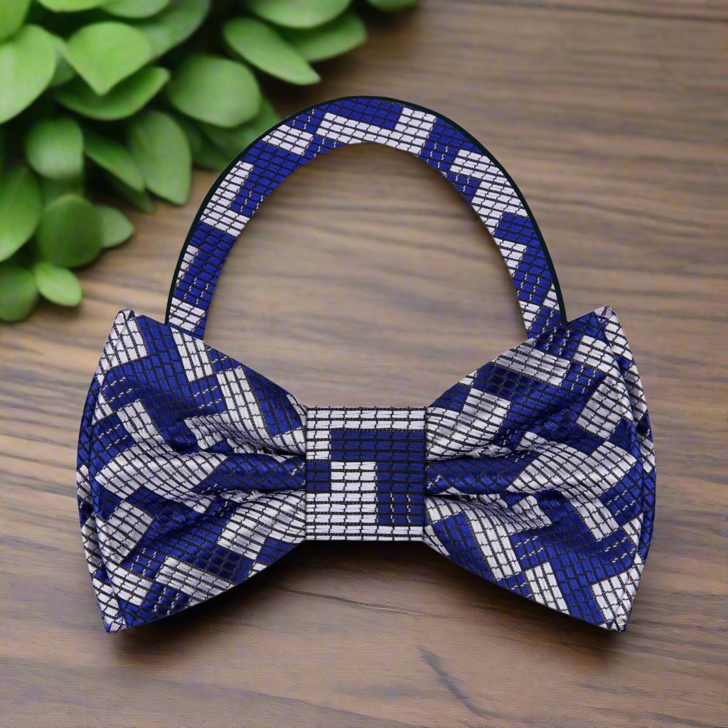 Close-up of a large houndstooth bow tie in red and silver for weddings
