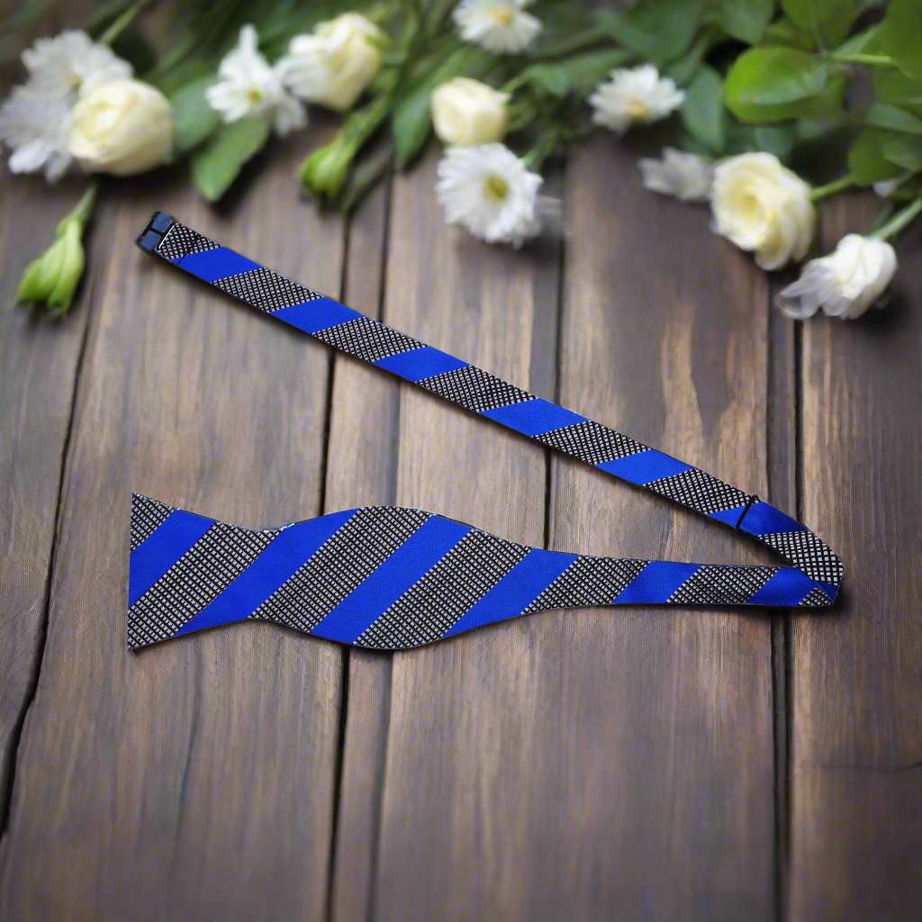 Grey silk bow tie styled with a charcoal suit for a sophisticated look