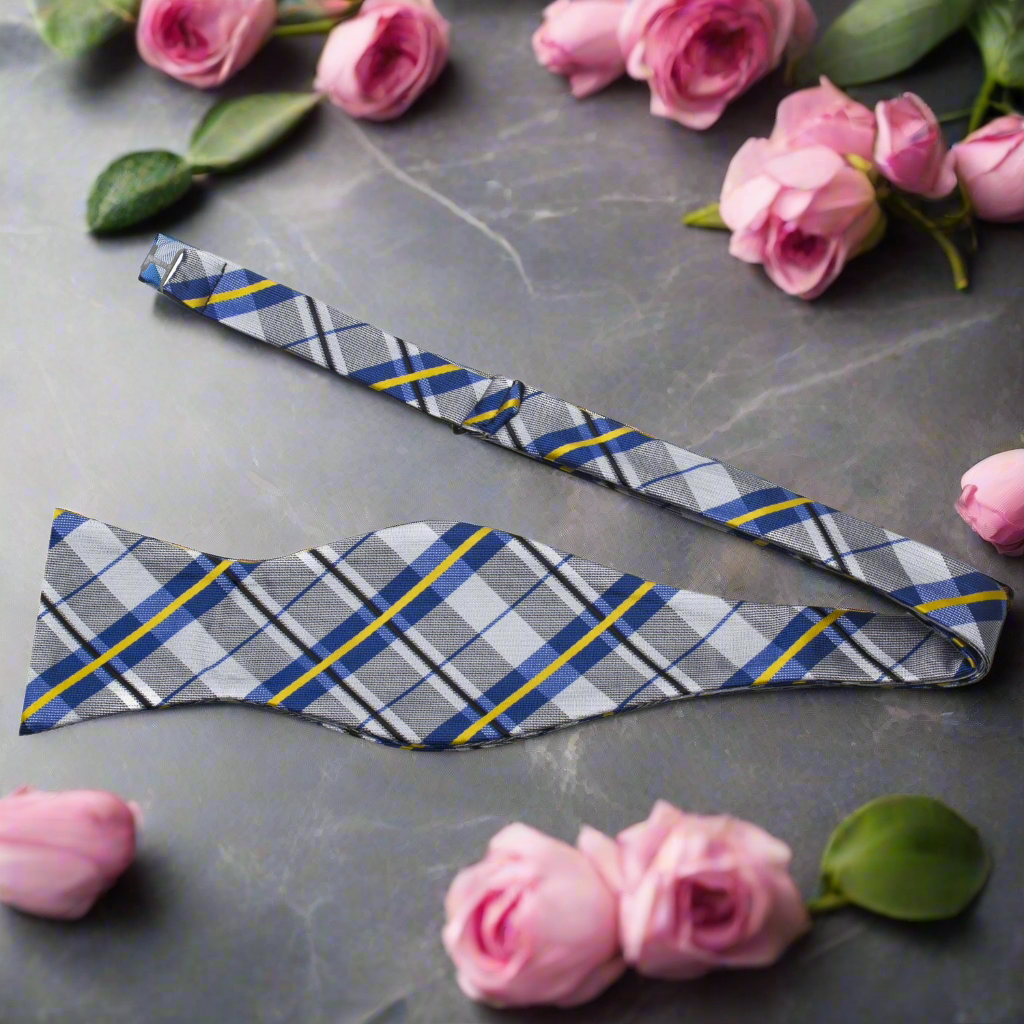 Men wearing a stylish plaid bow tie with a white dress shirt at a formal gathering