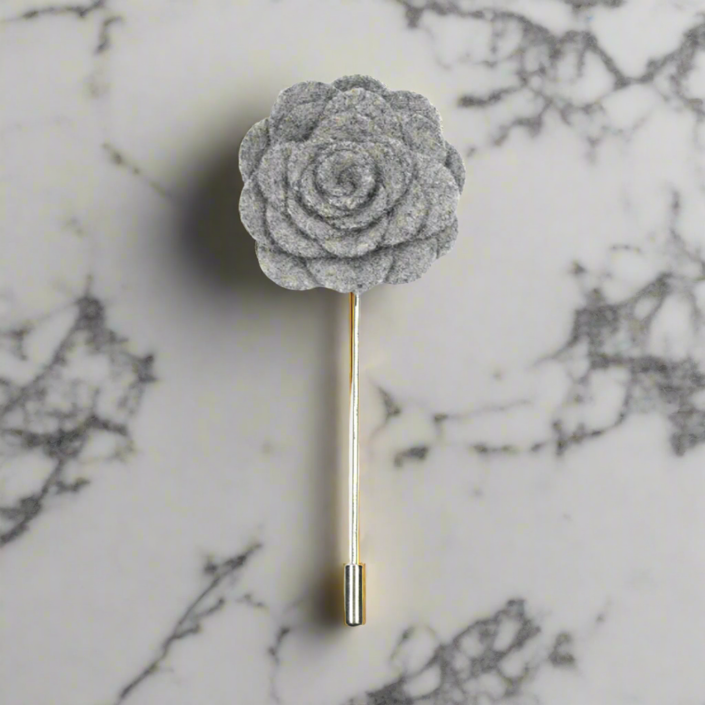 Close-up of vibrant petal lapel pin on a suit jacket