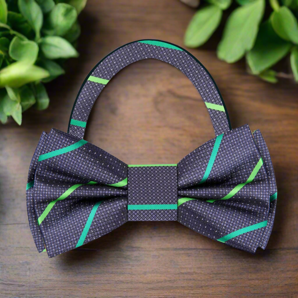 Close-up view of a dark blue silk bow tie with a brown stripe pattern, ideal for weddings