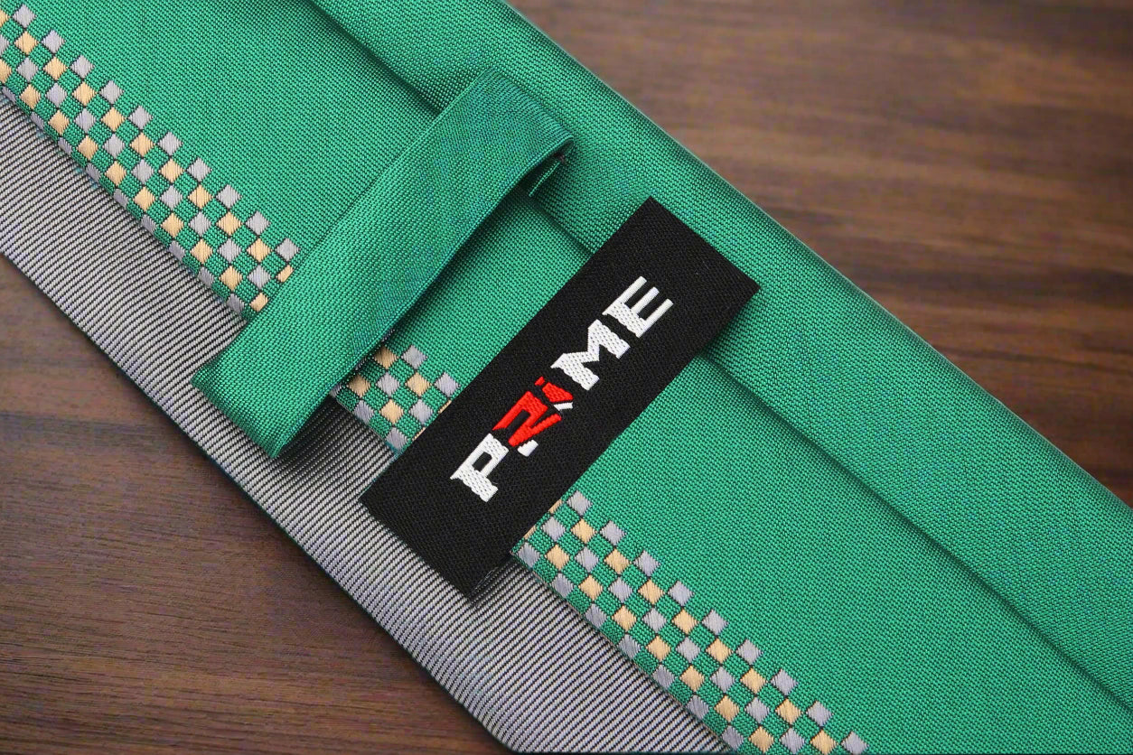 Detail view of the grey and green checkered tie, showcasing the fabric texture and pattern.