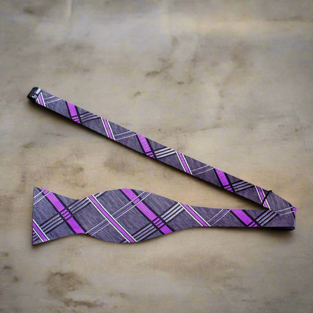 Bow tie paired with a light lavender suit, showcasing versatility for various events.