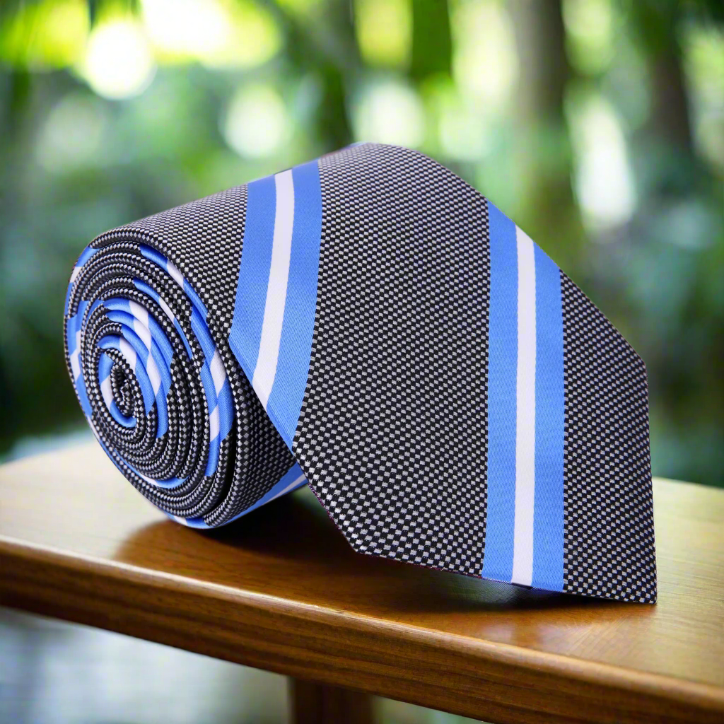 Elegant grey silk necktie with light blue and white stripes, draped over a white dress shirt.