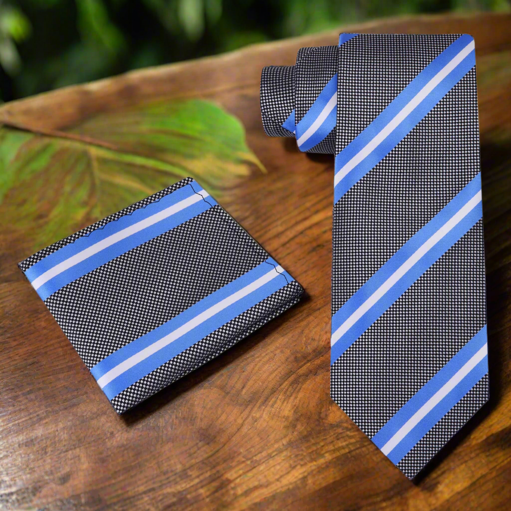 Elegant grey silk necktie with light blue and white stripes, draped over a white dress shirt.