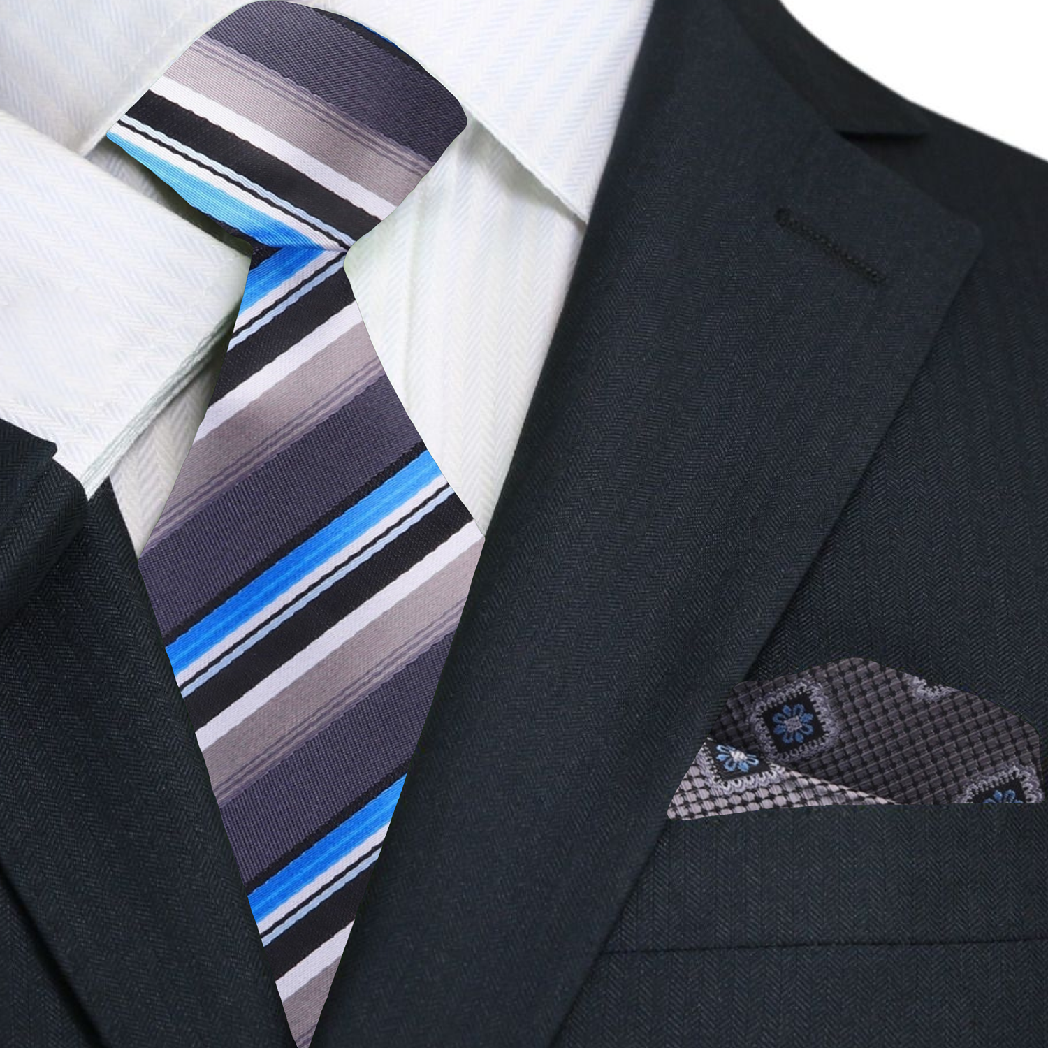 Stylish silver striped silk necktie worn with a light blue dress shirt.
