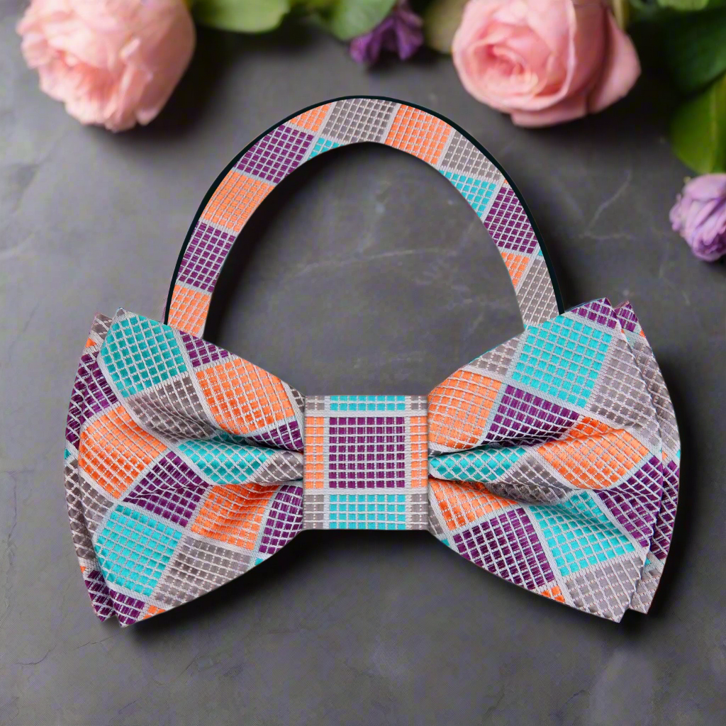 Elegant silk bow tie with bold geometric design for party or event