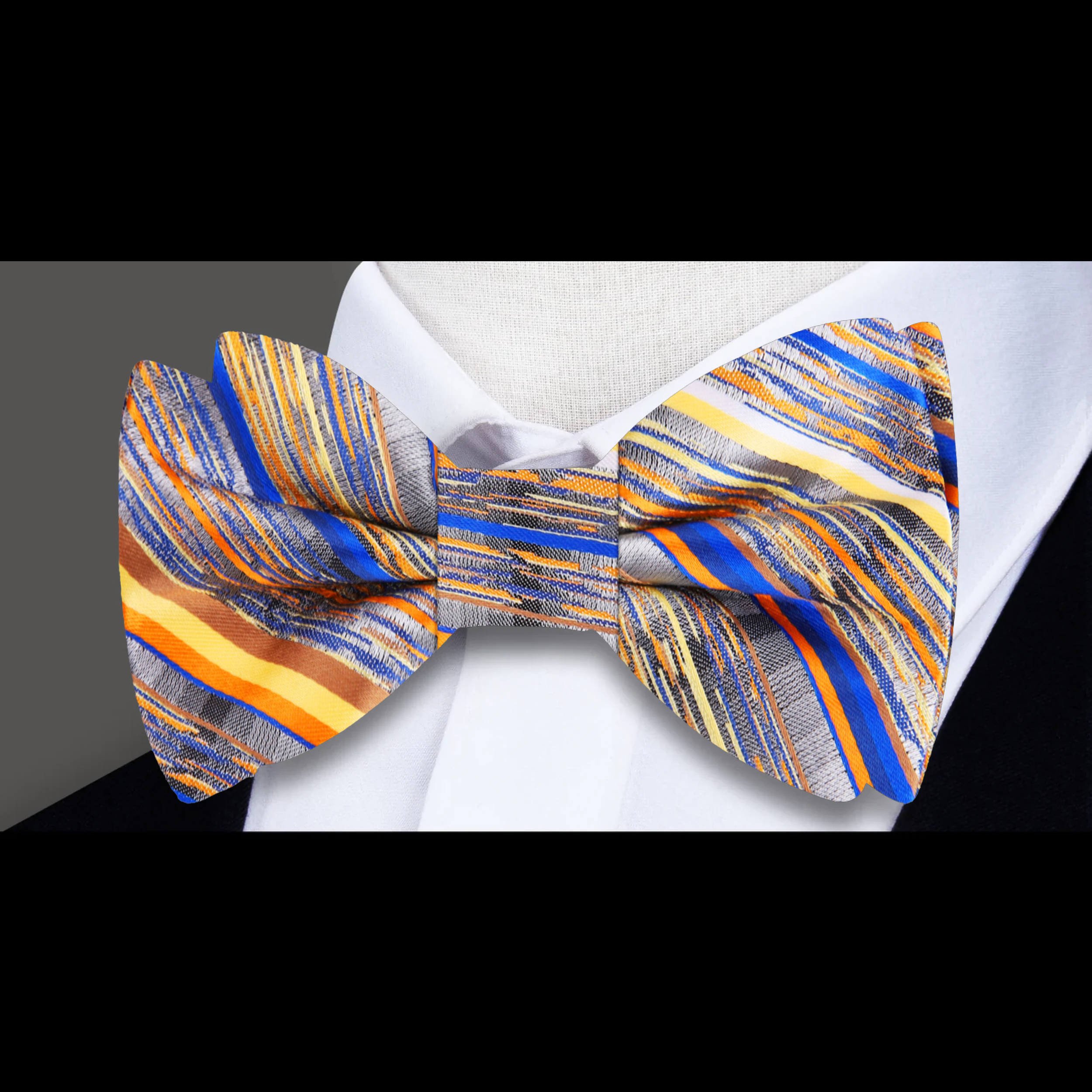 Gradient grey bow tie showcasing blue, orange, and yellow stripes viewed from the front.