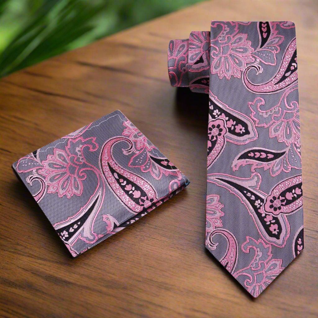 The paisley necktie styled with a soft pink dress shirt, ideal for a wedding event.