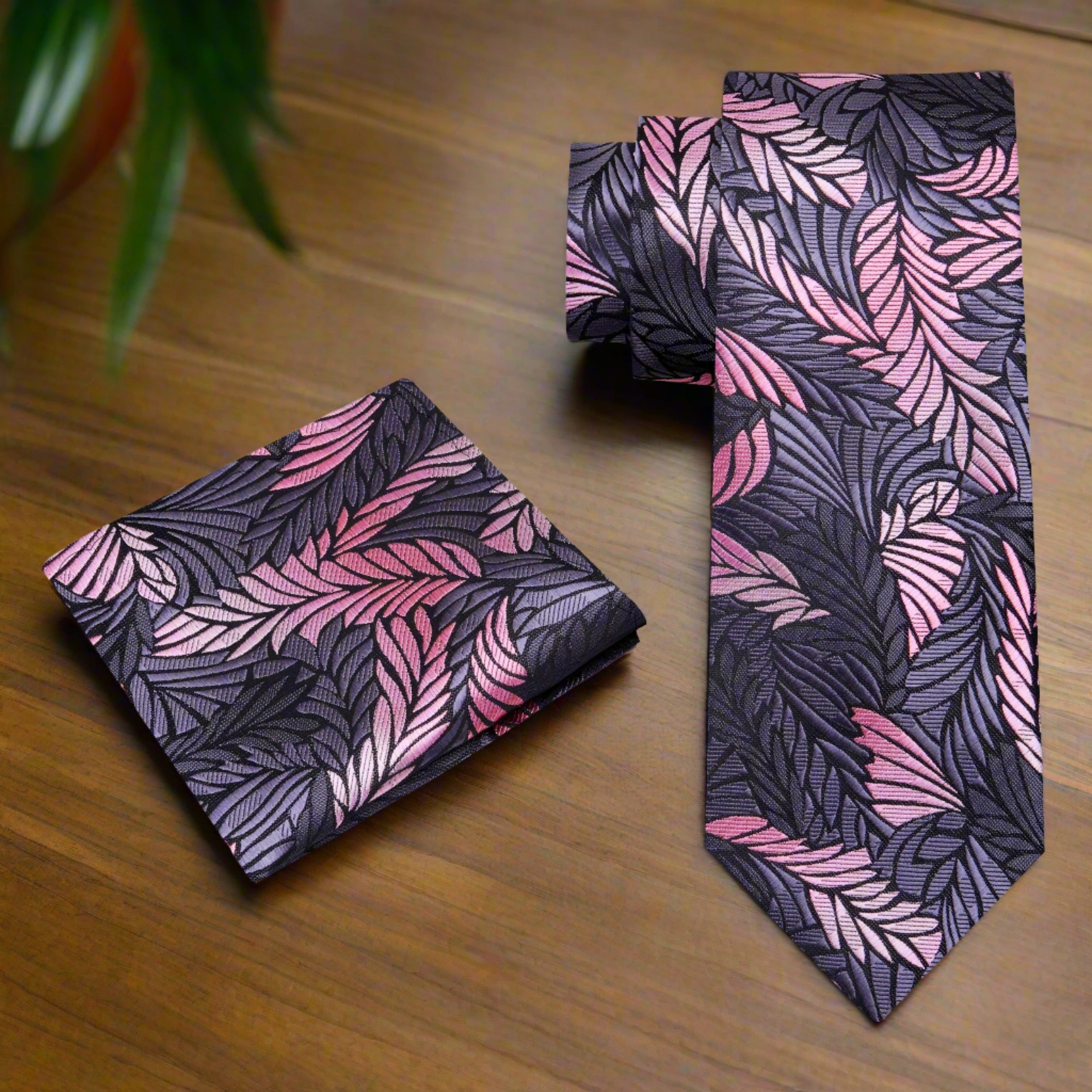 Close-up of lustrous gold geometric silk tie on a model