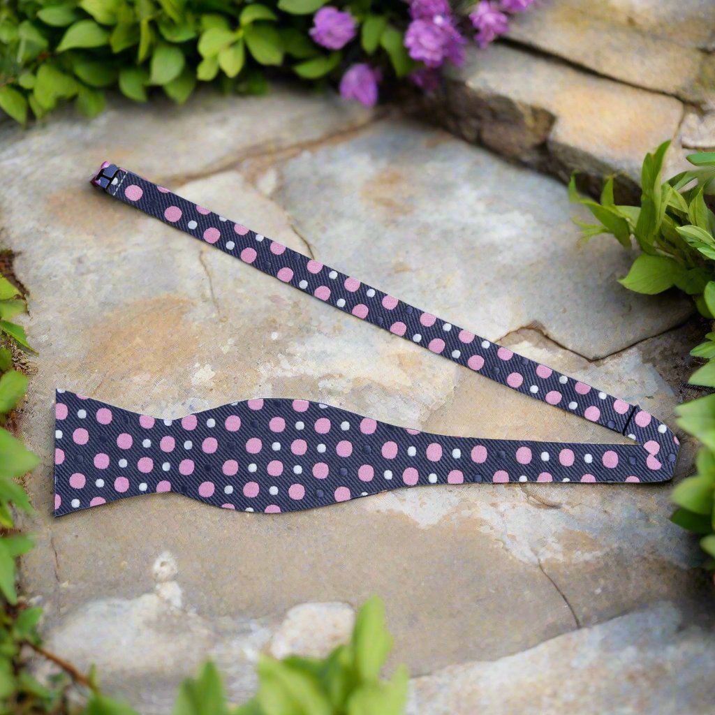 Versatile polka dot bow tie worn with a crisp white dress shirt, ideal for weddings.