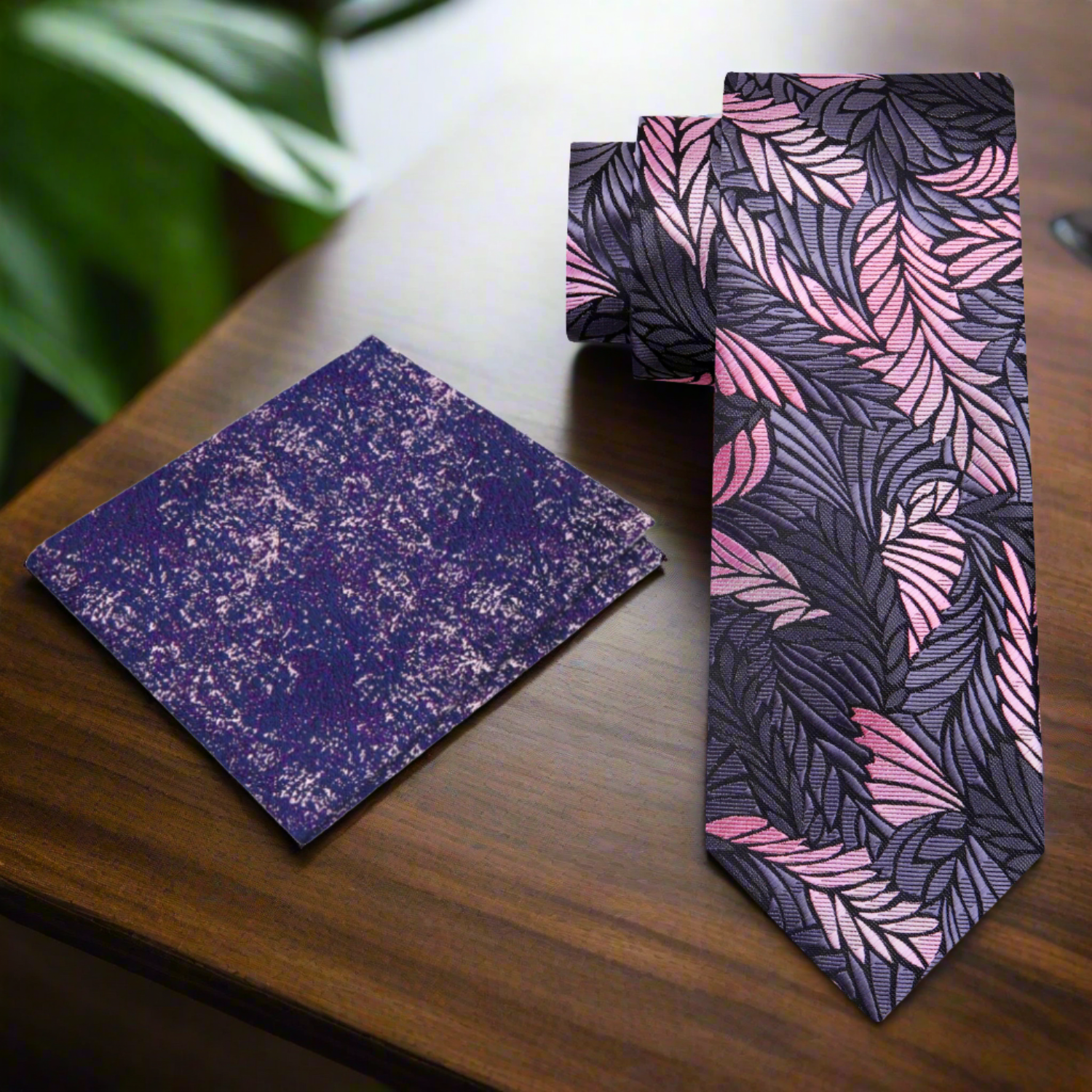 Close-up of lustrous gold geometric silk tie on a model