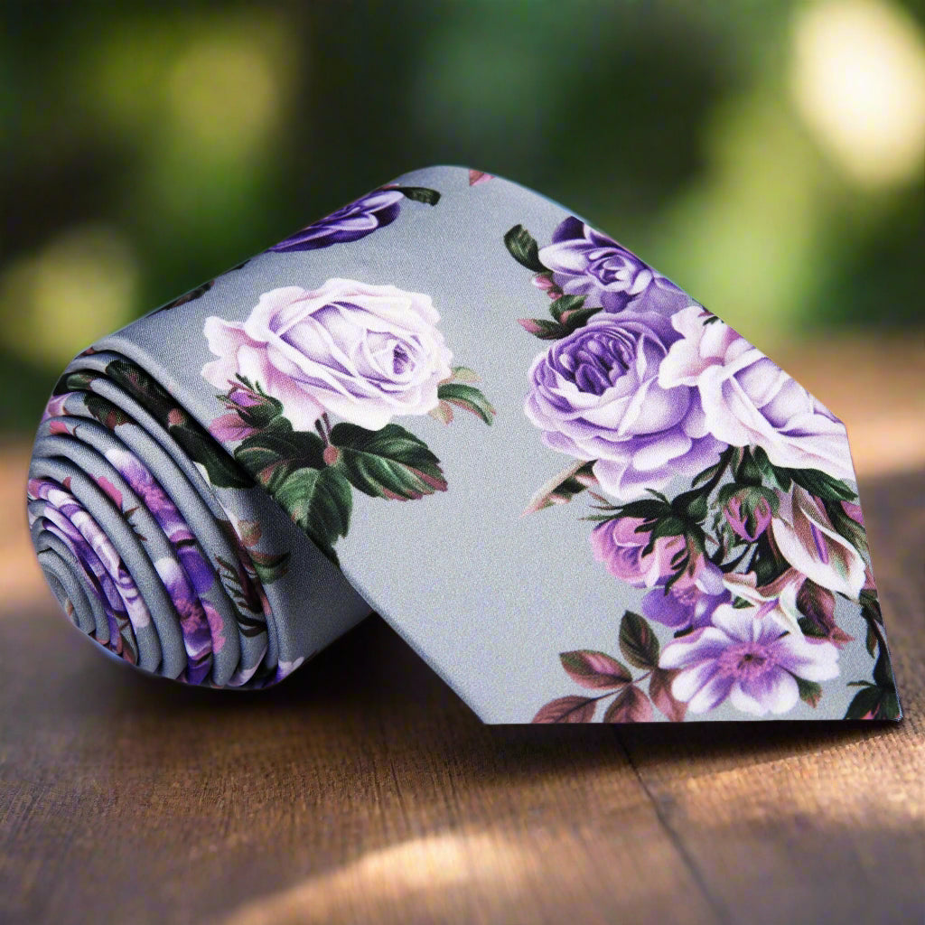 Close-up of floral silk necktie with roses pattern in pink and purple tones