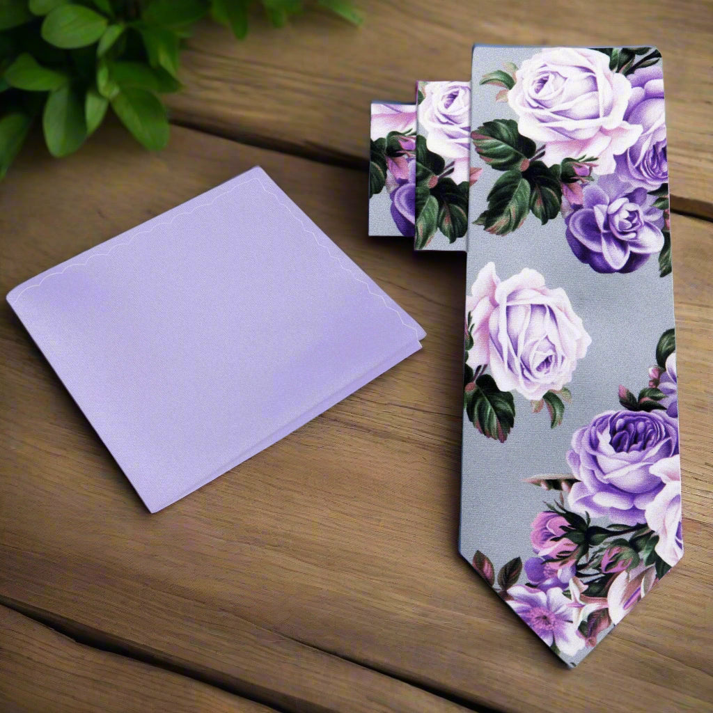 Close-up of floral silk necktie with roses pattern in pink and purple tones
