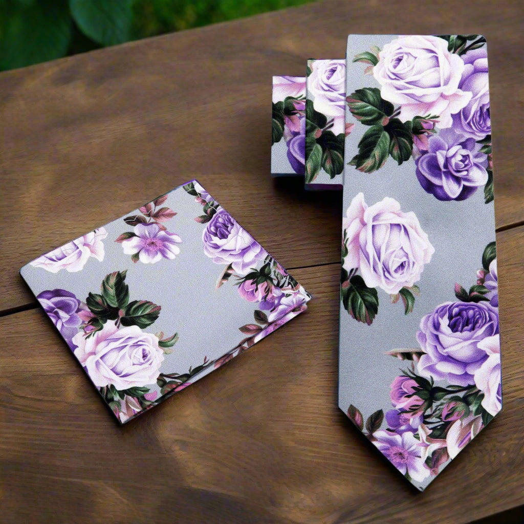 Close-up of floral silk necktie with roses pattern in pink and purple tones