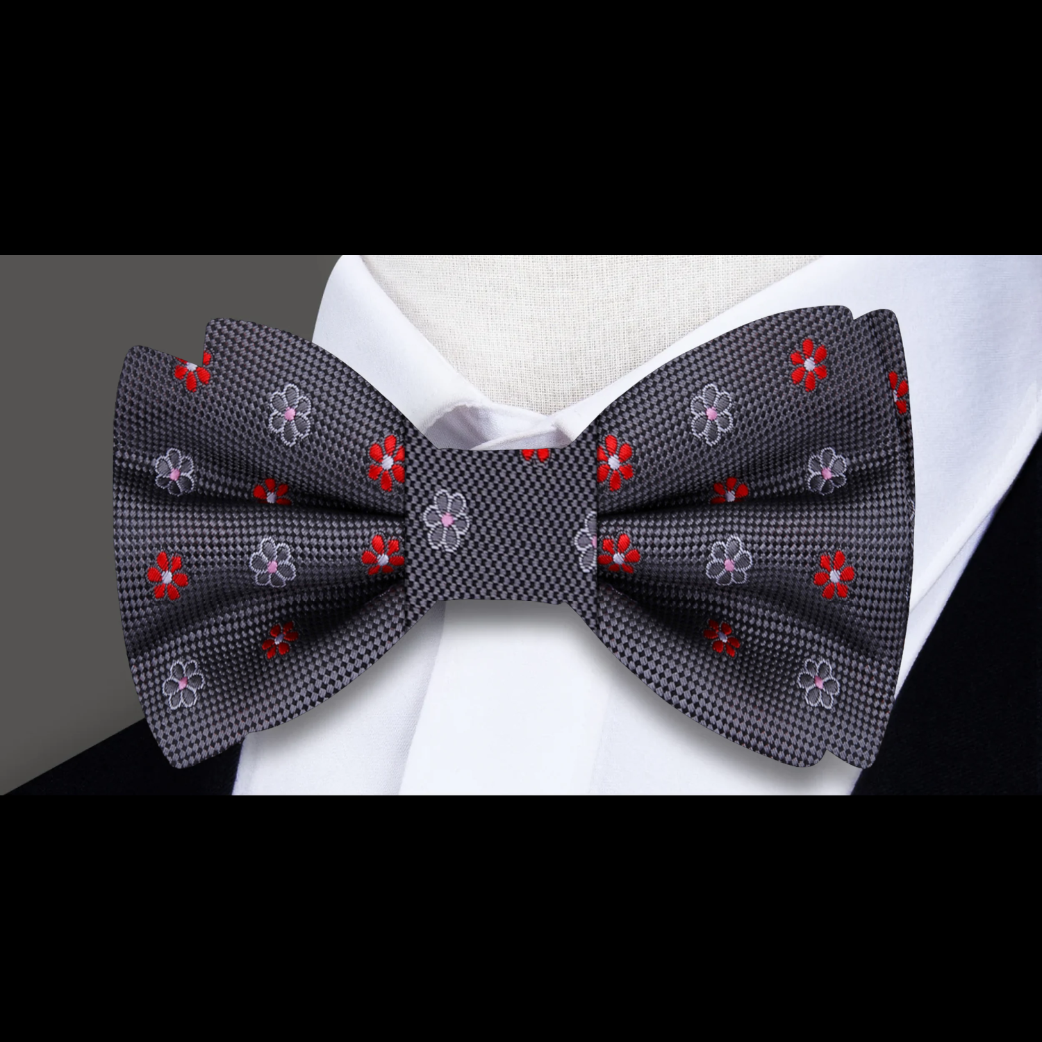 Fashionable man wearing pre-tied silk bow tie at a formal event