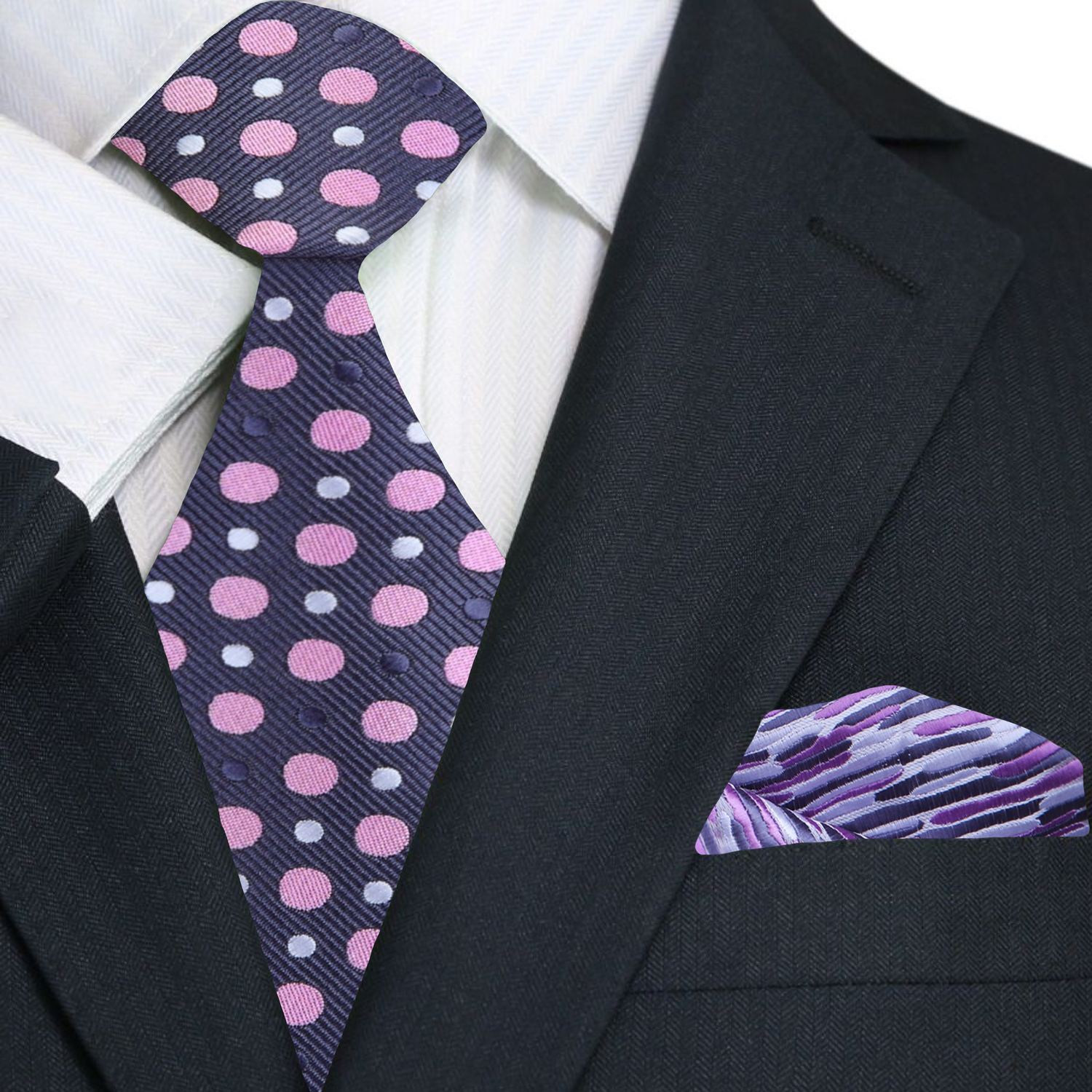 Stylish man wearing a grey polka dot tie at a wedding, highlighting the ties elegant design.